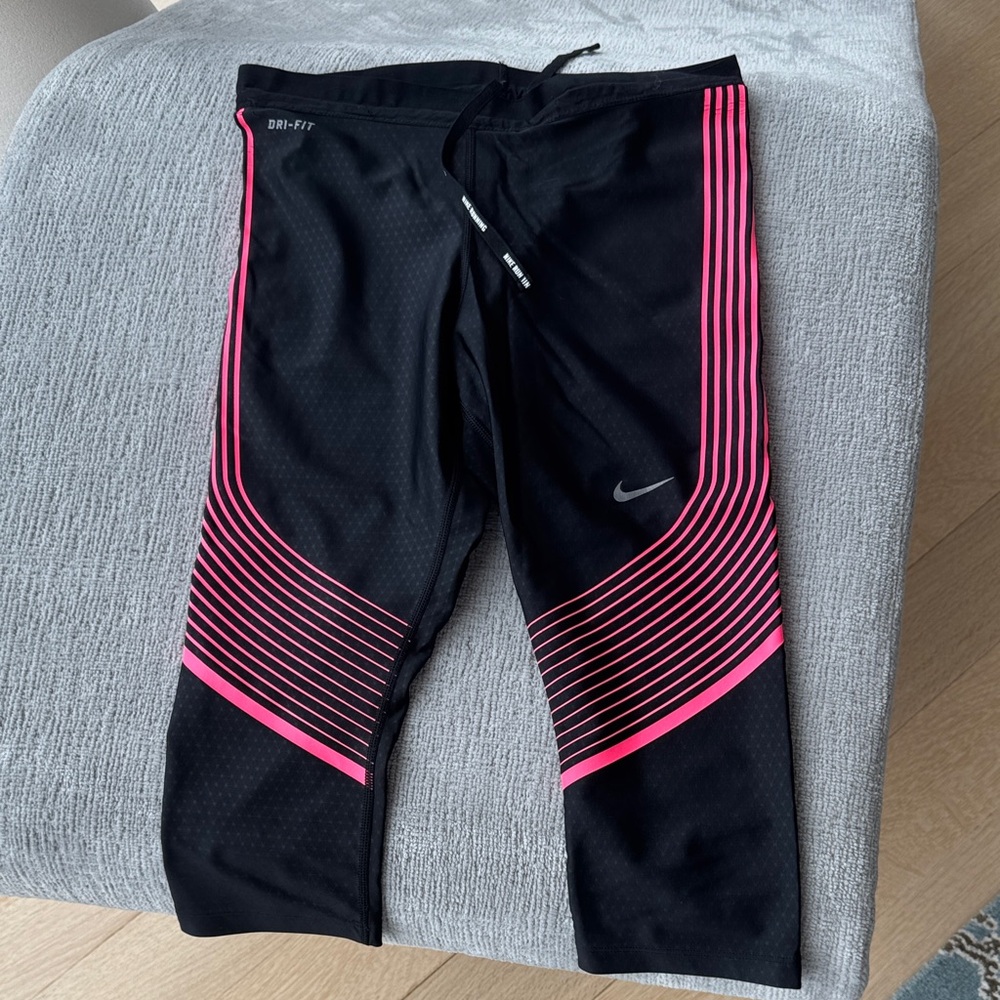 Nike Black Capri Leggings with Pink Stripe Accents